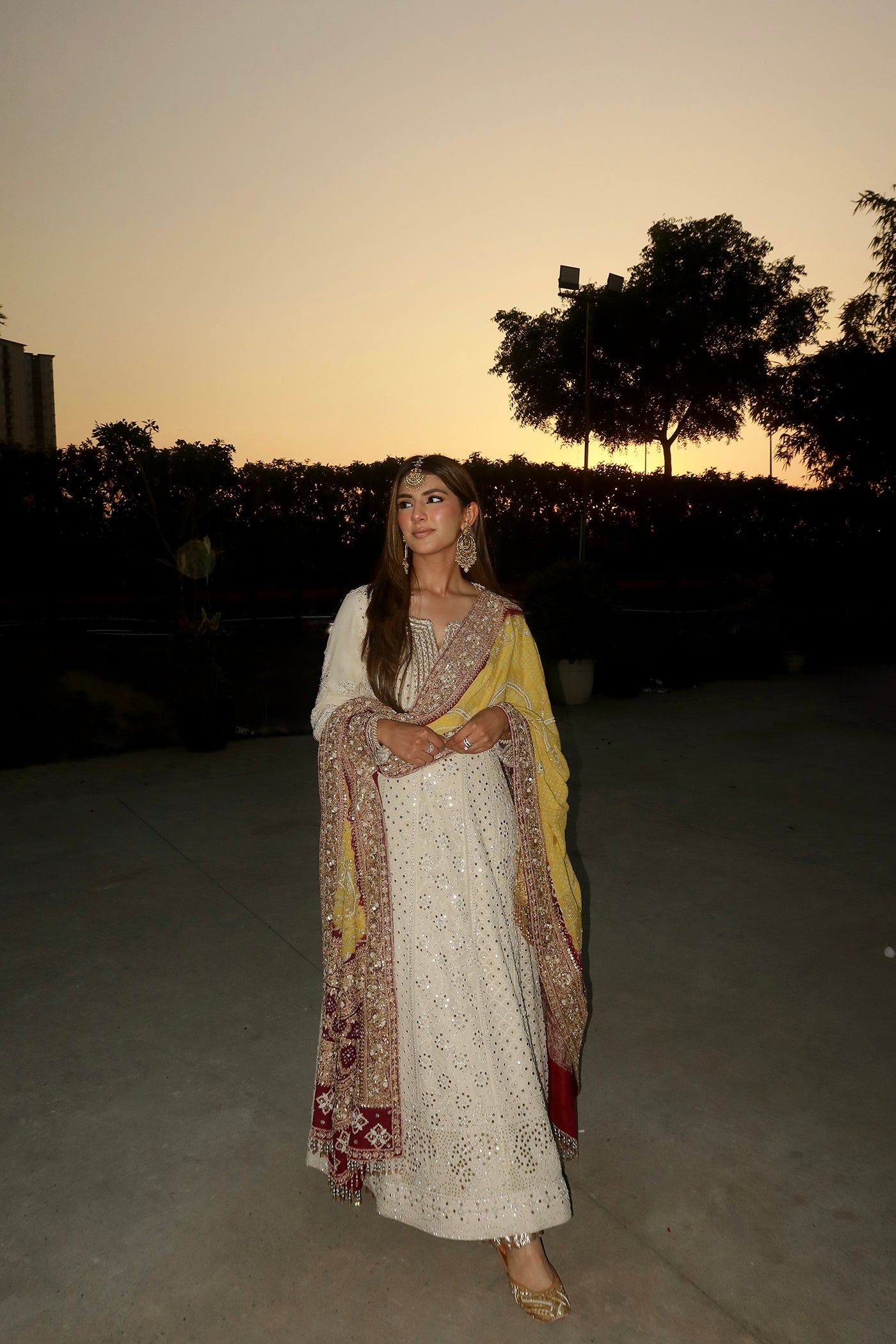 MEHER TALUJA In Ivory chikankari anarkali with yellow purple bandhani dupatta