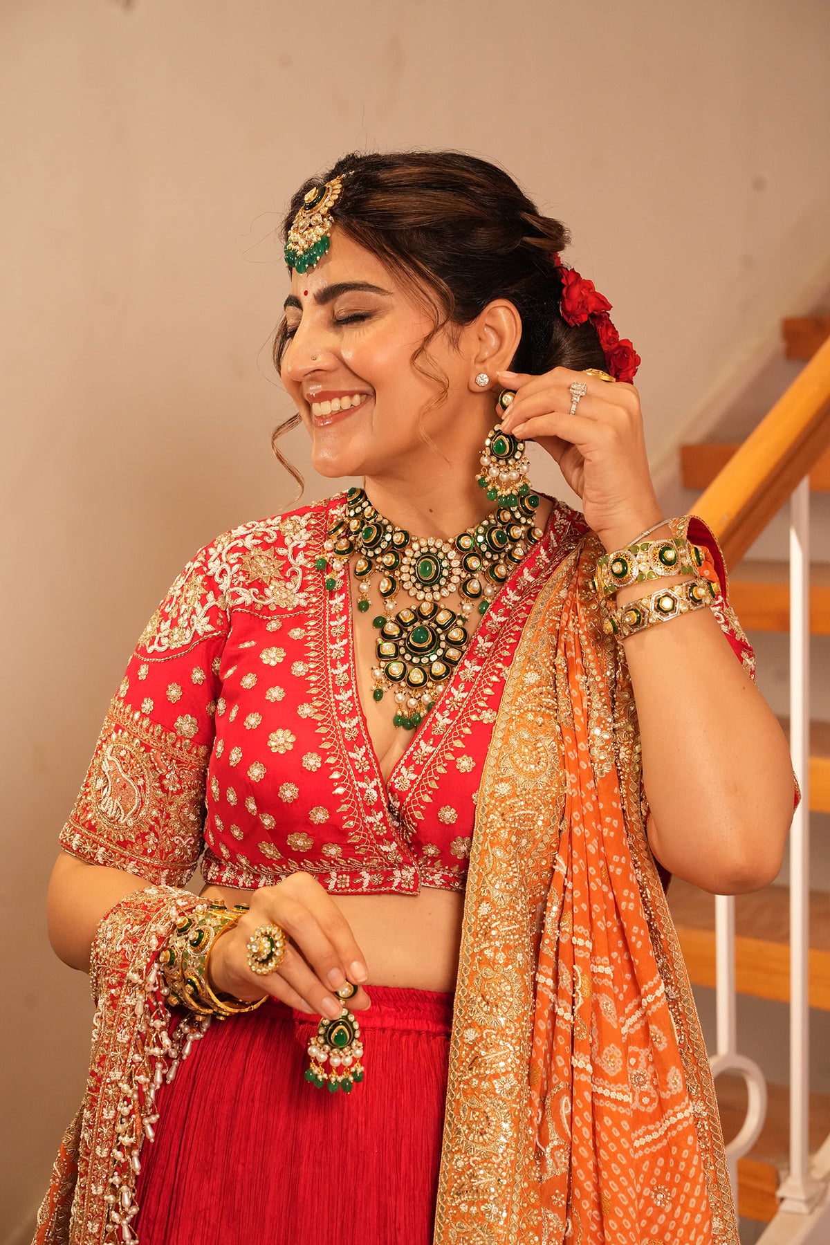 Ankita Kochar In Ruby Red Crush Lehenga with Orange Bandhani Dupatta