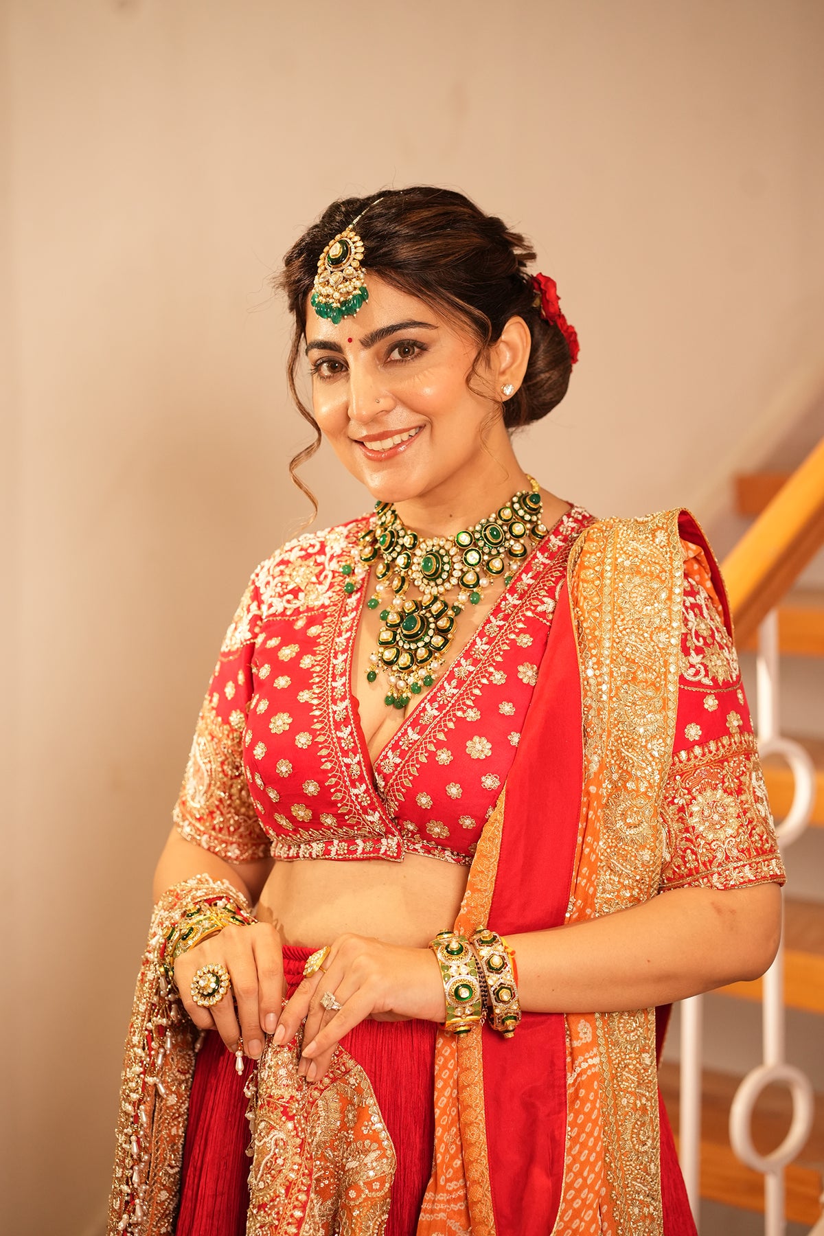 Ankita Kochar In Ruby Red Crush Lehenga with Orange Bandhani Dupatta