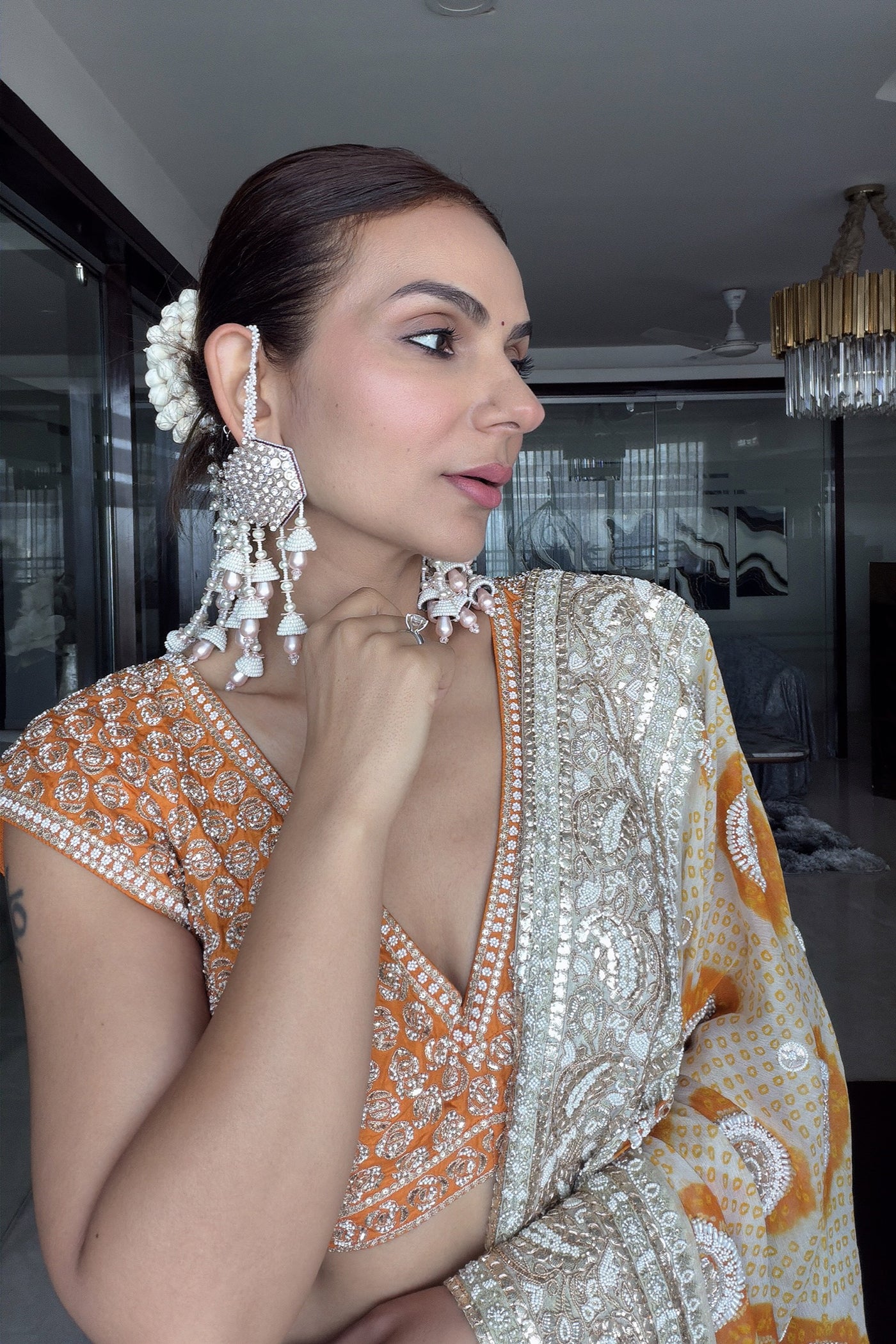 GAURI MEHTA In ivory crush lehenga set with ivory orange bandhani dupatta