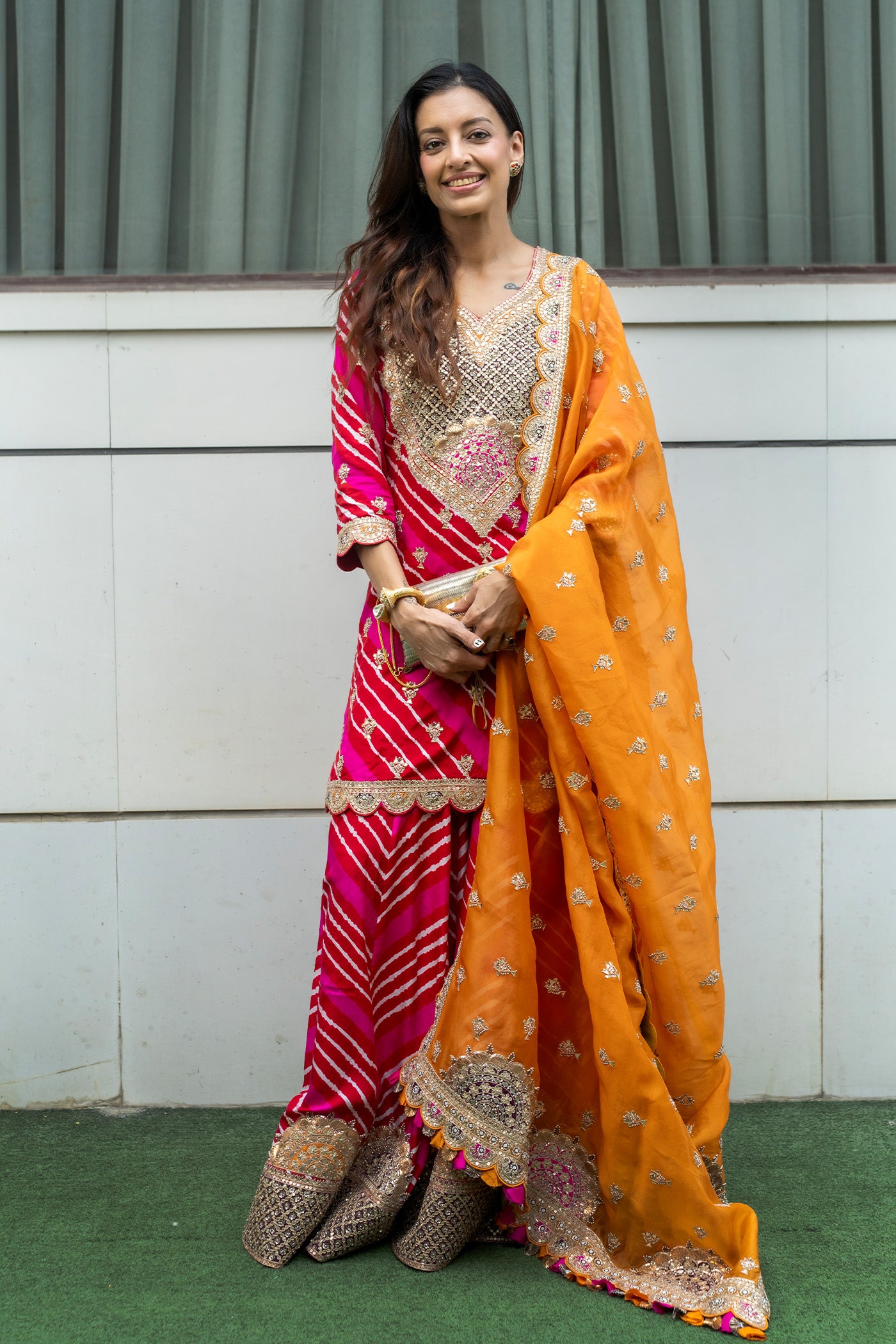 SHWETA MALPANI IN RED AND PINK LEHRIYA SHARARA KURTA SET WITH AN ORANGE ORGANZA DUPATTA